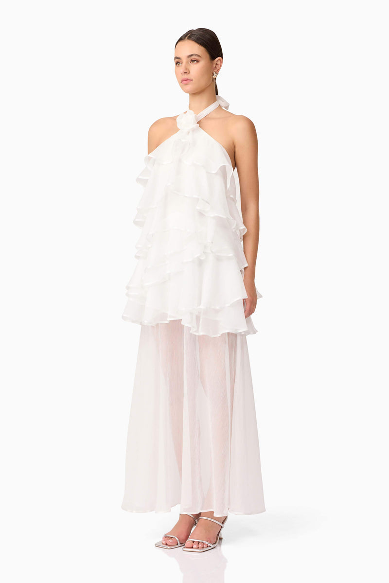 Brunette model wearing Melissa Halter Maxi Dress in White side shot