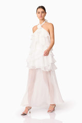 Brunette model wearing Melissa Halter Maxi Dress in White walking shot
