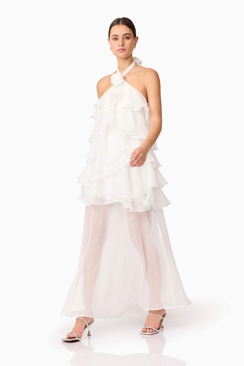 Brunette model wearing Melissa Halter Maxi Dress in White walking shot