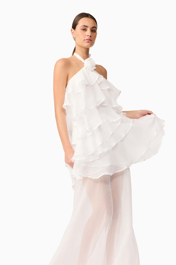 Brunette model wearing the Melissa Halter Maxi Dress in White close up shot 