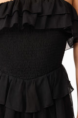 Brunette model wearing Melissa Strapless Maxi Dress in Black detail shot