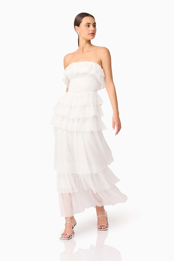 Brunette model wearing the Melissa Strapless Maxi Dress in White posed looking away shot 