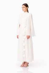 Brunette model wearing Melisa Long Sleeve Gown in White side shot