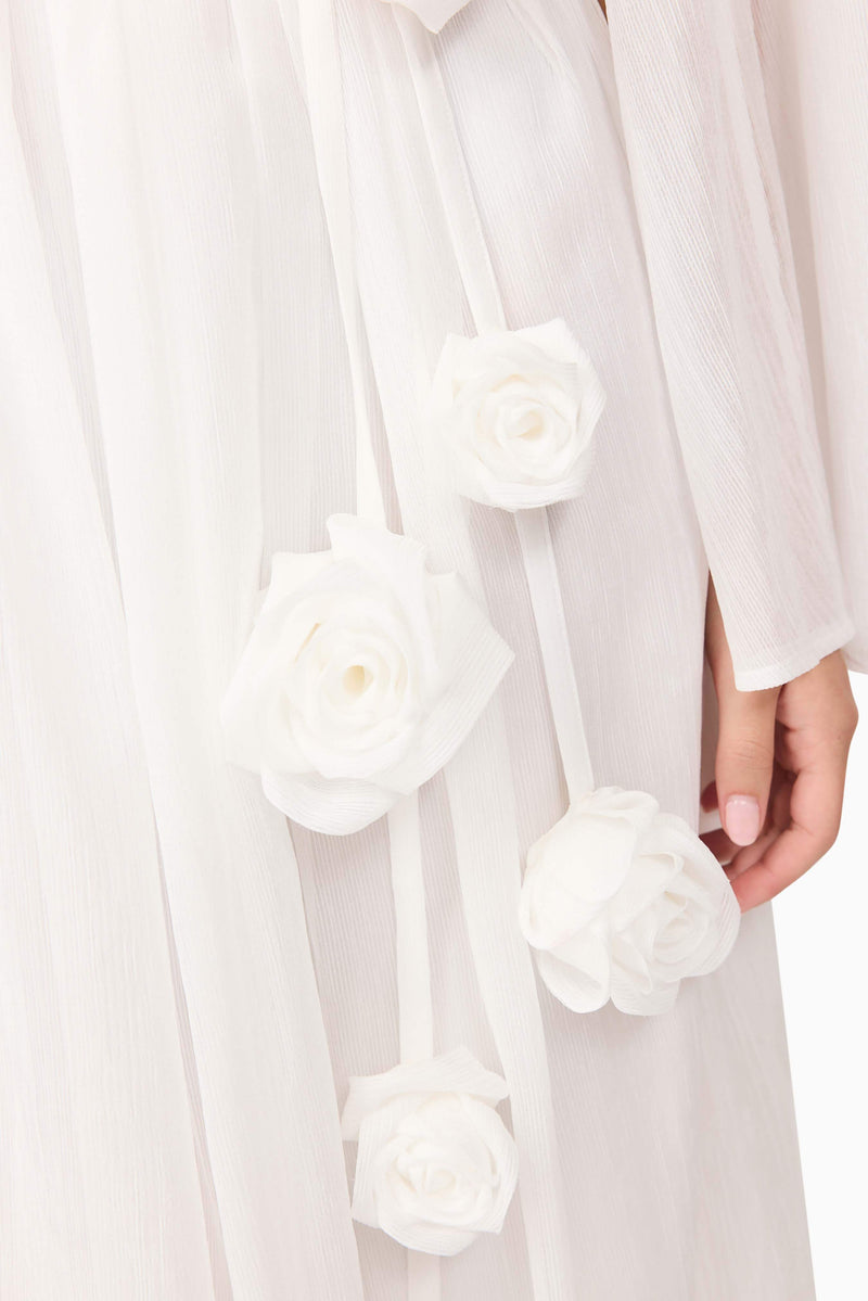 Brunette model wearing Melisa Long Sleeve Gown in White detail shot