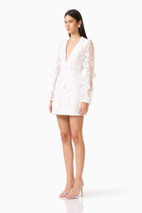 Lorina Flared Sleeve Mini Dress in White  with V-neckline &  sheer long sleeves with 3d floral appliques side shot 