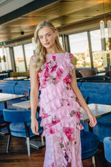 Model wears the Eleanora Ruffle Gown in Pink Floral to wedding reception 