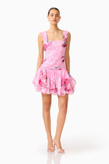 Eleanora Drop Waist Mini in Pink Floral with pleated bodice & tiered skirt in posed shot