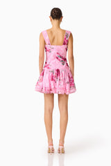 Eleanora Drop Waist Mini in Pink Floral with pleated bodice, zipper back & tiered skirt in back shot