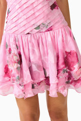 Eleanora Drop Waist Mini in Pink Floral with pleated bodice & tiered skirt hem detail shot