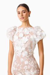 Brunette model wearing Astraea 3D Lace Maxi Dress In White close up detail shot