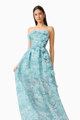 Brunette model wearing the Faye Strapless Gown in Blue motion pose shot