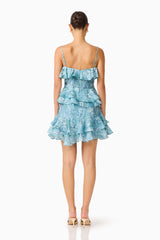 Brunette model wearing the Faye Mini Dress in Blue back shot