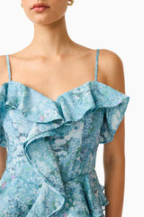 Brunette model wearing the Faye Mini Dress in Blue close up shot