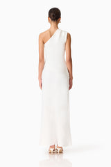 Brunette model wearing the Skye One Shoulder Gown in White back shot