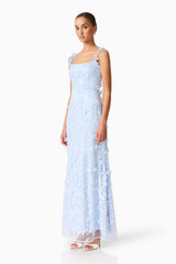 Brunette model wearing the Rina Embellished Gown in Blue side shot