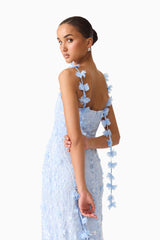 Brunette model wearing the Rina Embellished Gown in Blue close up back shot