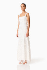 Brunette model wearing the Rina Gown in White side shot