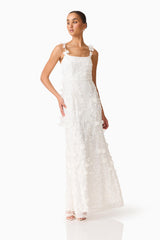 Brunette model wearing the Rina Gown in White posed shot