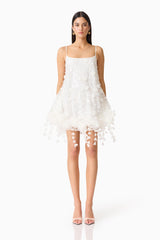 Brunette model wearing the Rina Shift Mini Dress in White front shot.