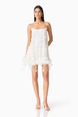 Brunette model wearing the Rina Shift Mini Dress in White posed shot.