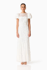 Brunette model wearing the Rina Puff Sleeve Gown in White front shot