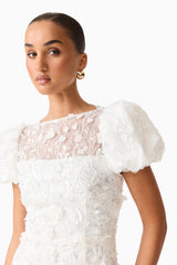 Brunette model wearing the Rina Puff Sleeve Gown in White close up shot