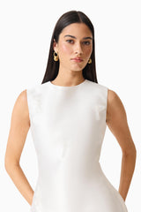 Brunette model wearing the Tula Shift Mini Dress in White close up shot