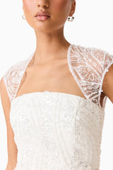 Brunette model wearing the Daelia Embellished Gown White detail shot