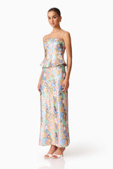 Brunette model wearing the Athea Gown in Floral side shot