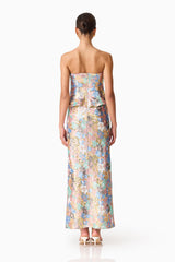 Brunette model wearing the Athea Gown in Floral back shot