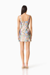 Brunette model wearing the Athea Mini in Floral back shot