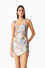 Brunette model wearing the Athea Mini in Floral posed close up shot