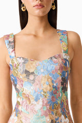 Brunette model wearing the Athea Mini in Floral detailed shot