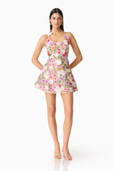Brunette model wearing The Neve A-Line Mini Dress in Pink Floral posed front shot