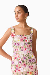 Brunette model wearing Neve Applique  Midi Dress in Pink Floral close up looking away shot