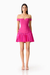 Brunette model wears the Elva Off Shoulder Mini Dress in Pink front shot