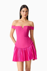Brunette model wears the Elva Off Shoulder Mini Dress in Pink up close shot