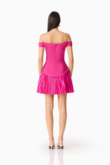 Brunette model wears the Elva Off Shoulder Mini Dress in Pink back shot