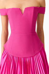 Brunette model wears the Elva Off Shoulder Mini Dress in Pink detail shot