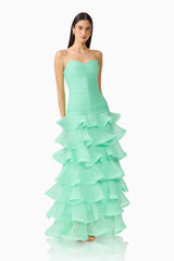 Brunette model wearing the Evelin Tiered Gown in Mint Green posed shot