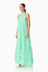 Carla Halter Gown in Mint Green with ruffle hem detailing & relaxed fit side shot