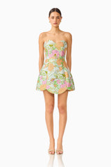 Brunette model wearing the Noralyn Strapless Mini Dress in Green Floral front shot