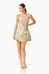 Brunette model wearing the Noralyn Strapless Mini Dress in Green Floral posed shot