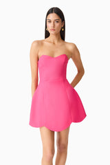 Brunette model wearing Noralyn Strapless Mini Dress in Pink close up shot