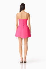 Brunette model wearing Noralyn Strapless Mini Dress in Pink back shot
