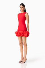 Brunette model wearing the Celia Bubble Mini Dress in Red side shot 