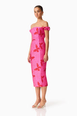 Brunette model wearing the Lorena Jacquard Off Shoulder Midi Dress in Pink side shot