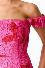 Brunette model wearing the Lorena Jacquard Off Shoulder Midi Dress in Pink detail shot