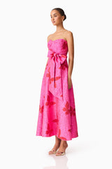 Brunette model wearing The Lorena Jacquard Strapless Gown in Pink side shot