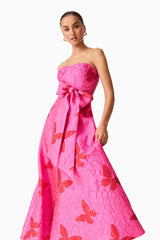 Brunette model wearing The Lorena Jacquard Strapless Gown in Pink close up posed shot